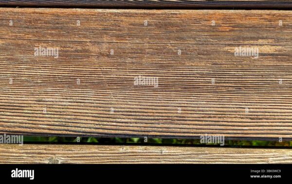 Close-up of weathered wooden planks with visible grain and natural texture.