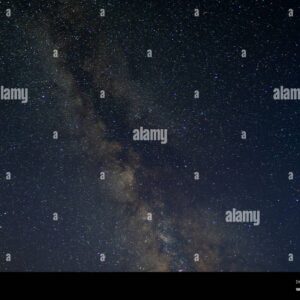 Wide view of the Milky Way galaxy stretching across a clear night sky filled with stars.